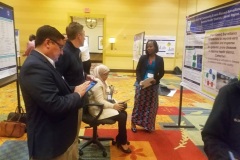 gaBriefing a Frontline on his poster during the International Forum on Public Health Emergency Management, 2022